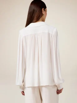 Blusa in tessuto crêpe con catena