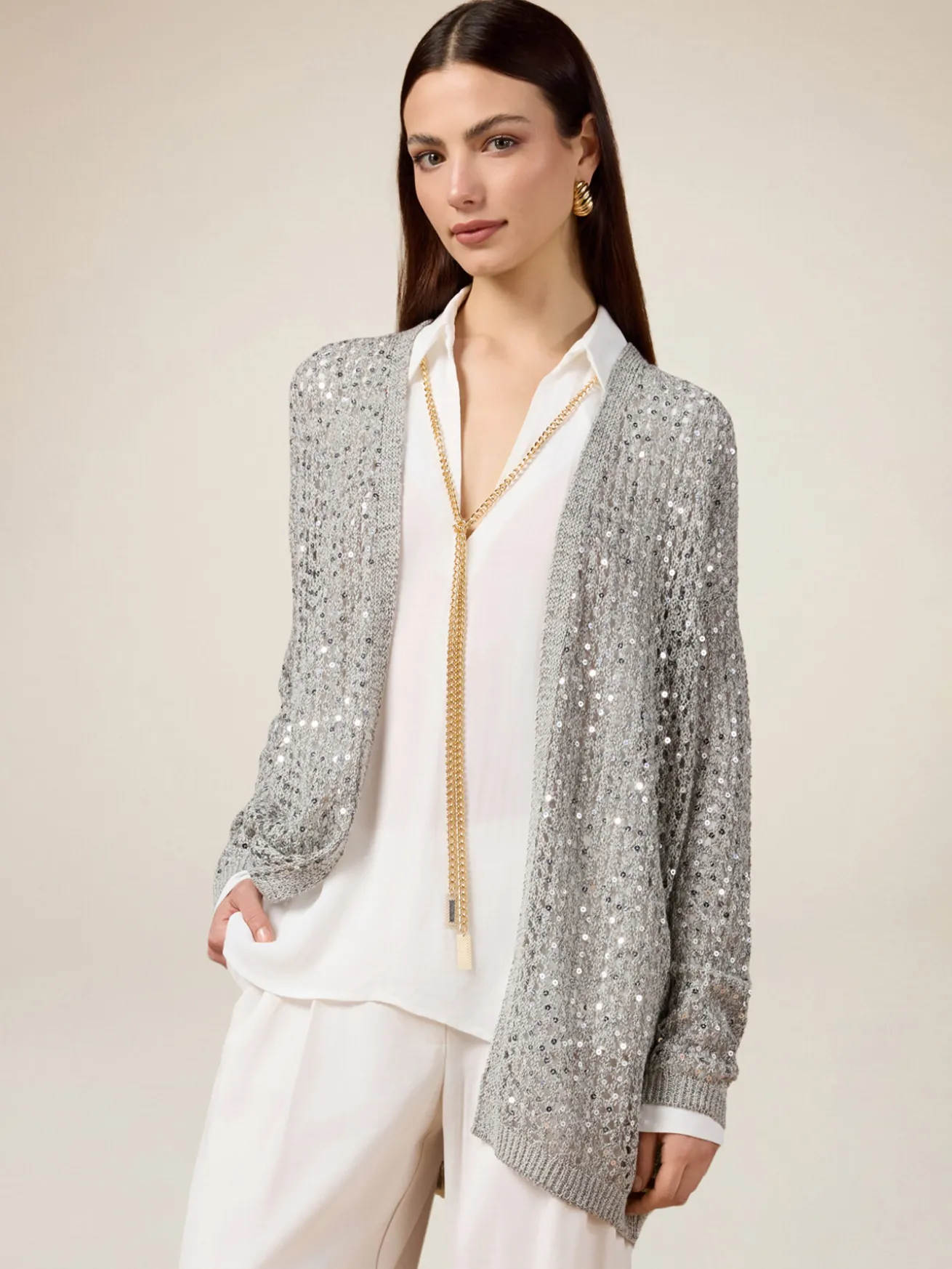 Cardigan traforato con paillettes