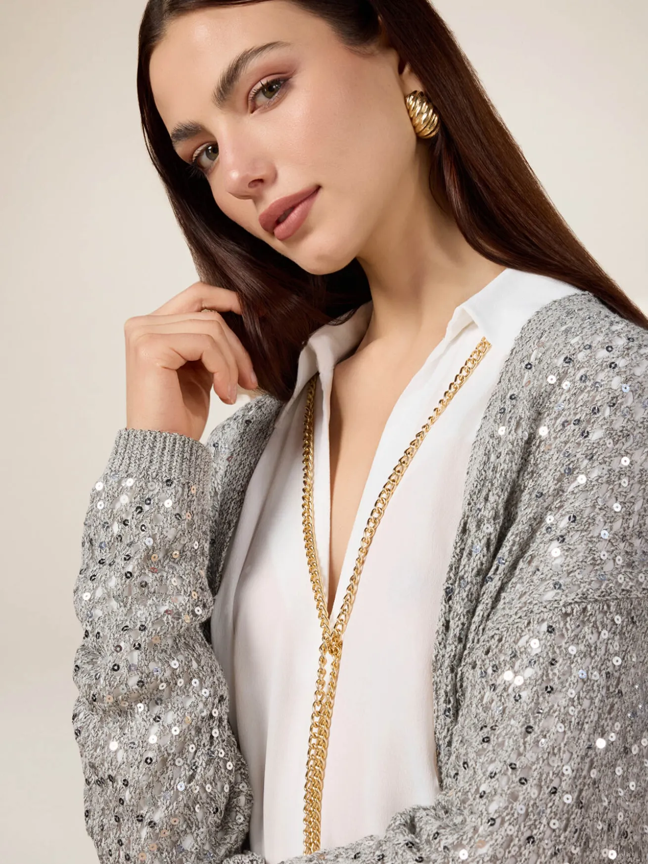 Cardigan traforato con paillettes