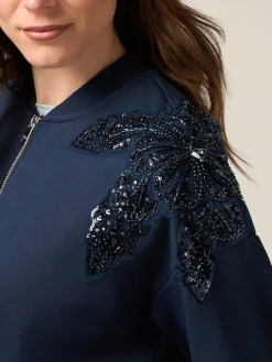 Felpa con zip e ricamo gioiello