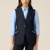 Gilet denim con catene metalliche
