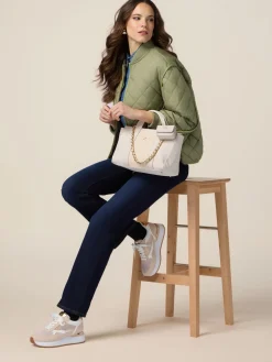 Jeans regular blu rinse con bottoni dorati