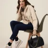 Jeans skinny blu rinse con bottoni sul fondo gamba