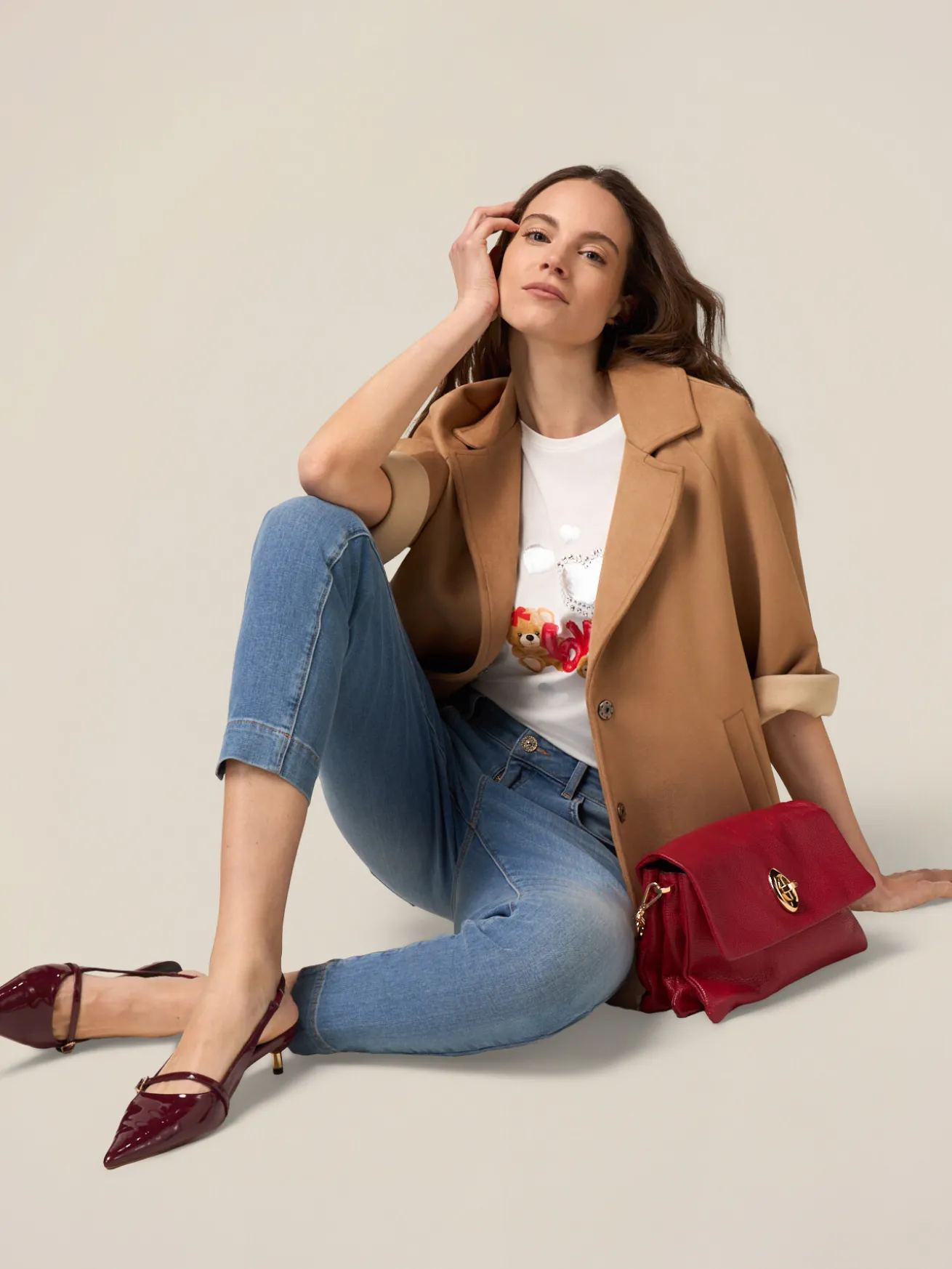Jeans skinny push up con dettaglio catena
