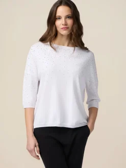 Maglia con pioggia di borchiette/strass
