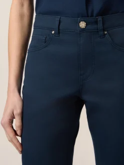 Pantaloni skinny in cotone e tencel con bottone gioiello