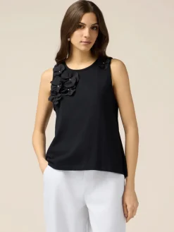 Top in jersey con applicazioni floreali