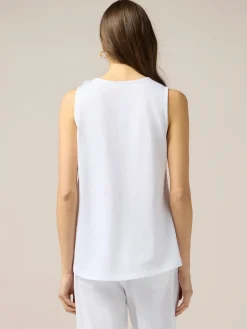 Top in jersey con applicazioni floreali