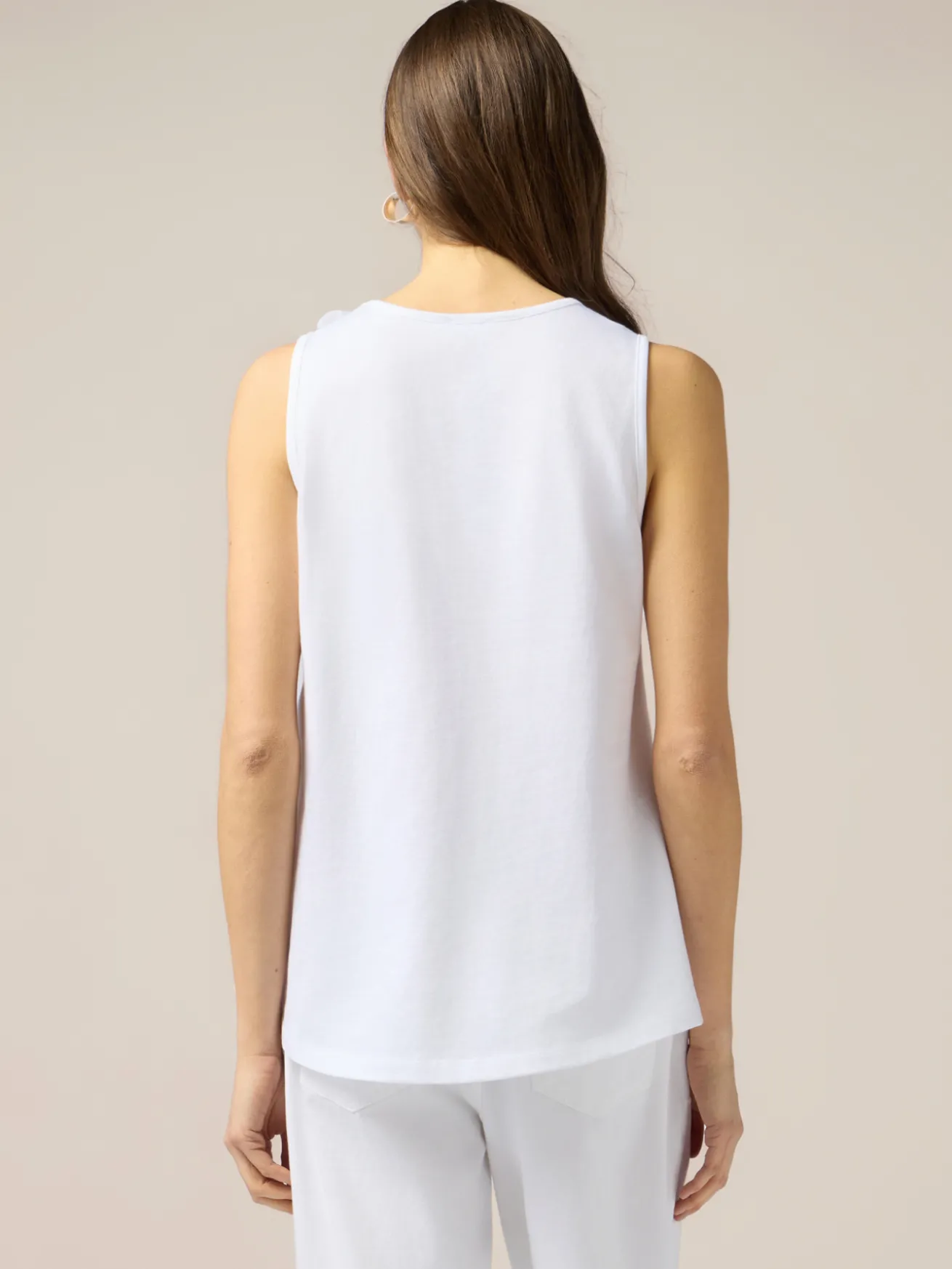 Top in jersey con applicazioni floreali